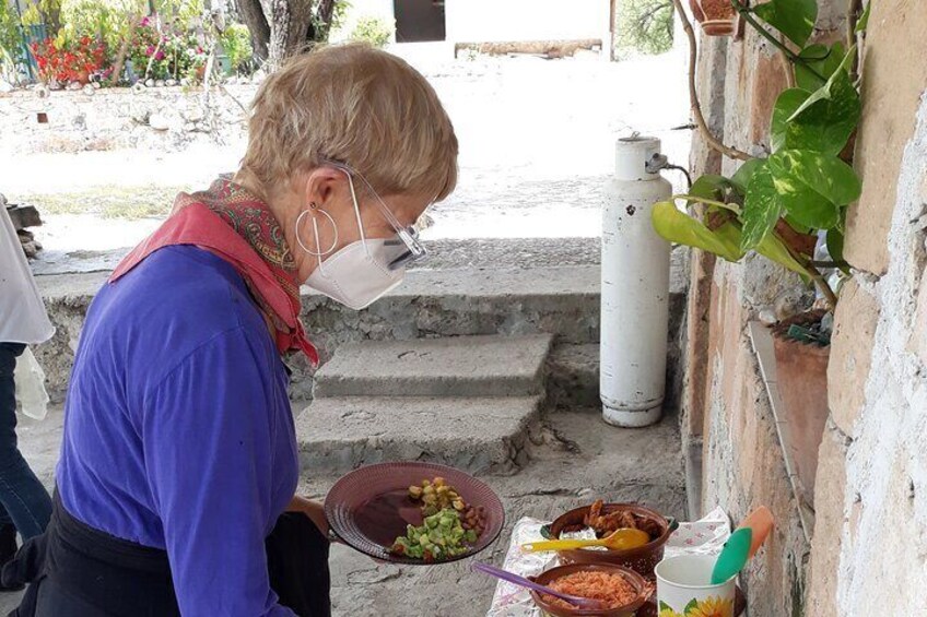 Wearing masks while dishing up!