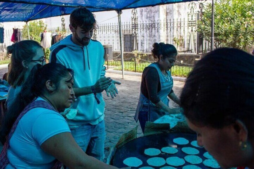 making typical Tortillas at a local shop in one of the villages around Antigua Guatemala