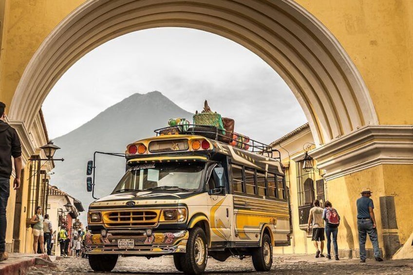 The Columbus Guatemala Travel Authentic Chicken Bus at Santa Catalina Arch