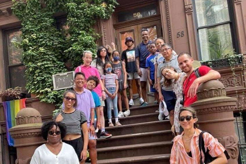 Guests walk through Mt. Morris Park Historic District. after church service, one of the most beautiful and history areas of Harlem / New York City