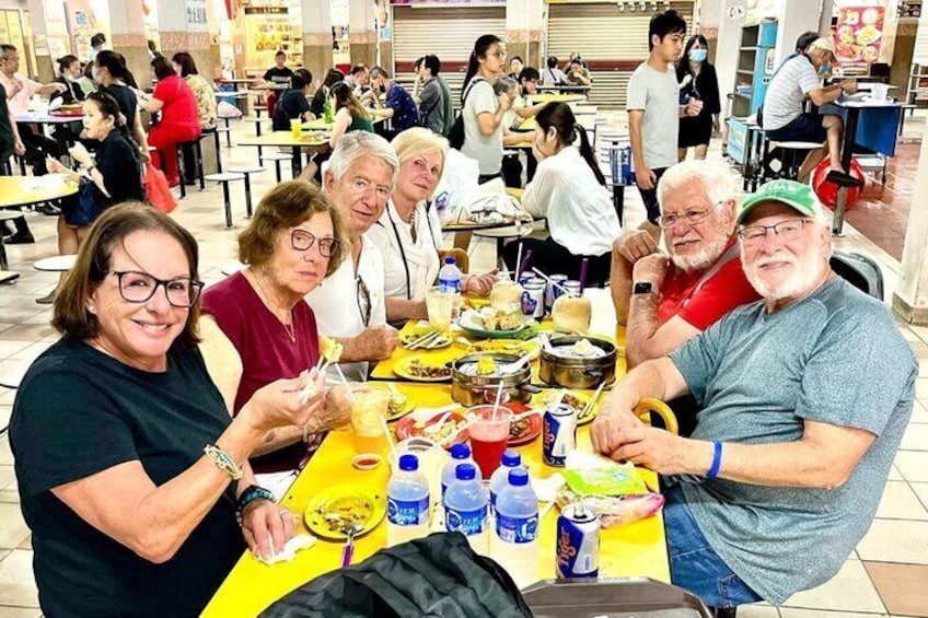 American cruise holiday guests having a nice sumptuous dinner spread of Asian favourites in Chinatown.
