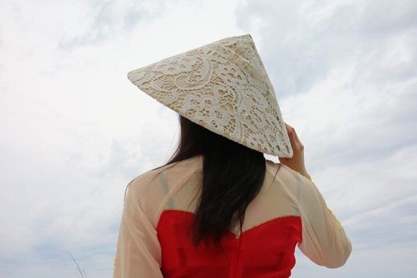 Jujin from Korean, choose a red and yellow Aodai for her trip to Vietnam.
