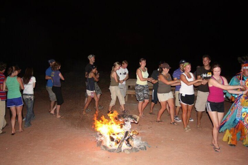 Dancing around campfire in Monument Valley