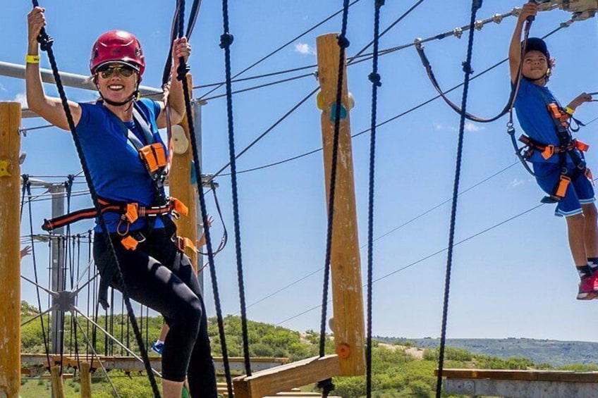 Navigate through obstacles up to 50ft in the air on one of the largest aerial park in Colorado.