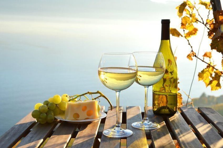 Wine and grapes against the sea
