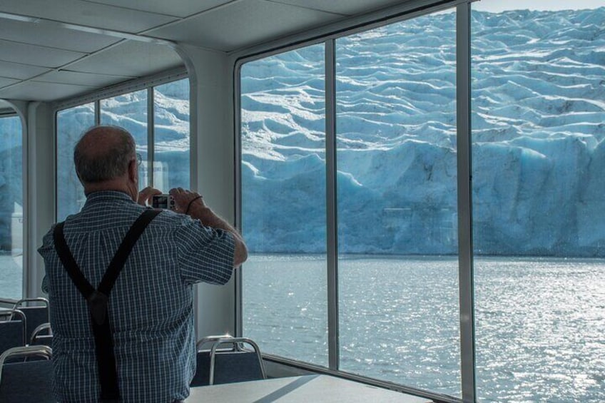 Guest getting up close to the Portage Glacier while staying warm