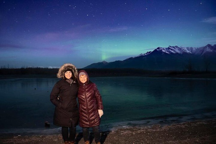 Aurora portrait by frozen river