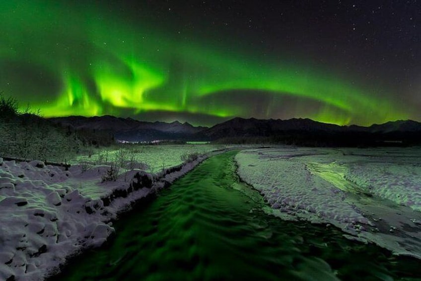 Northern lights and creek