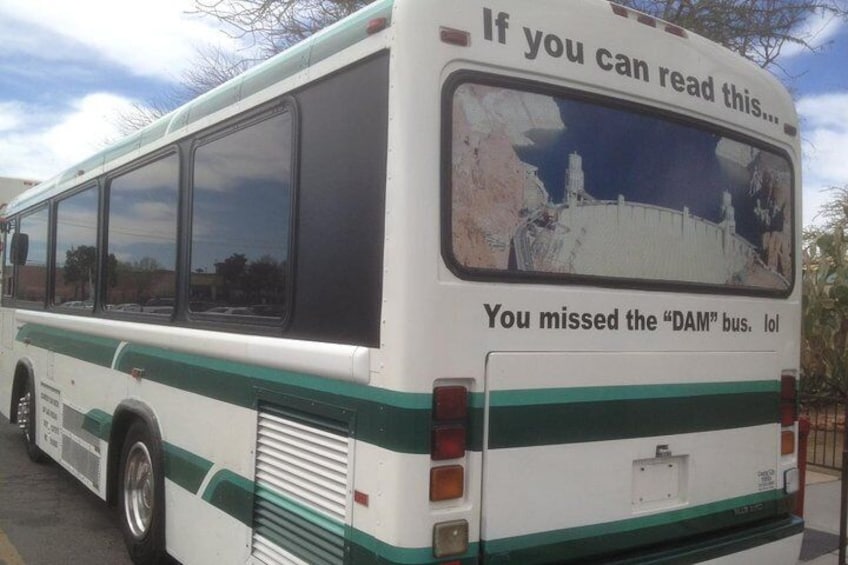 It say's "If you can read this, you missed the "dam" bus. HAHAHA!