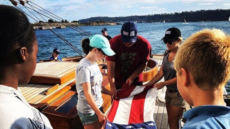 Kids folding the American Flag