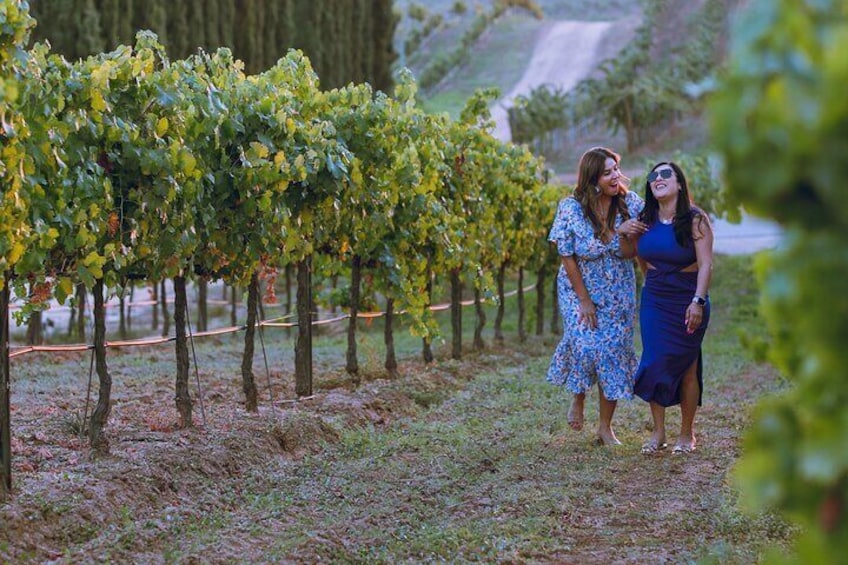 Friends enjoying a wine tour through the vineyard