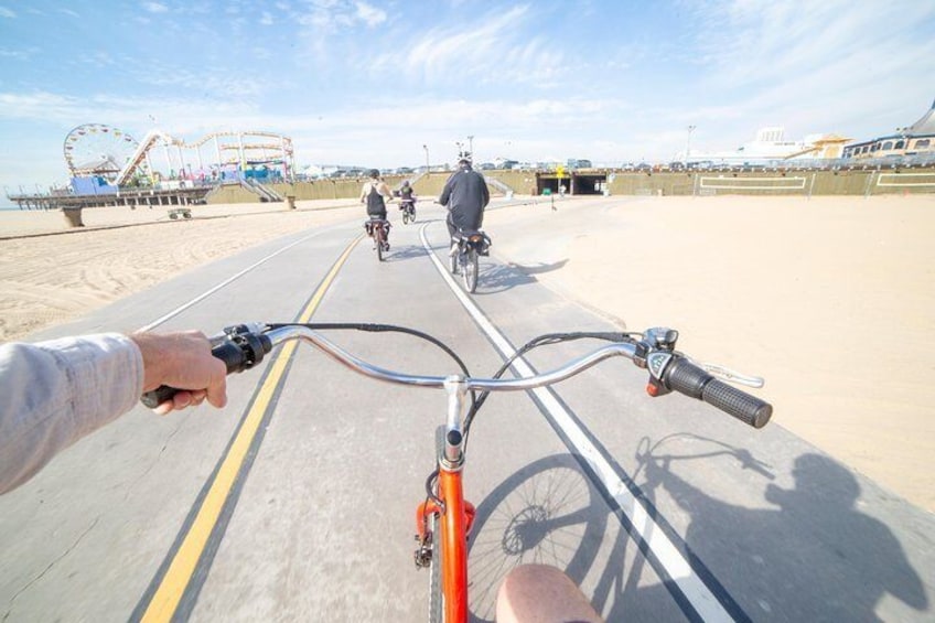 From behind the handlebar, cyclist views Santa Monica pier on this e-bike tour.