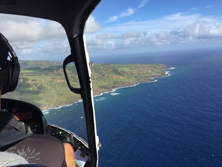 Passengers enjoy panoramic views of West Maui and Molokai's striking coastline.