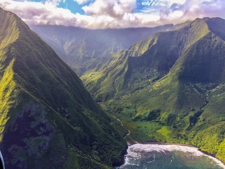 Deep valleys and towering mountains are continually shaped by seismic activity, rivers, and the sea on the Hawaiian island's.