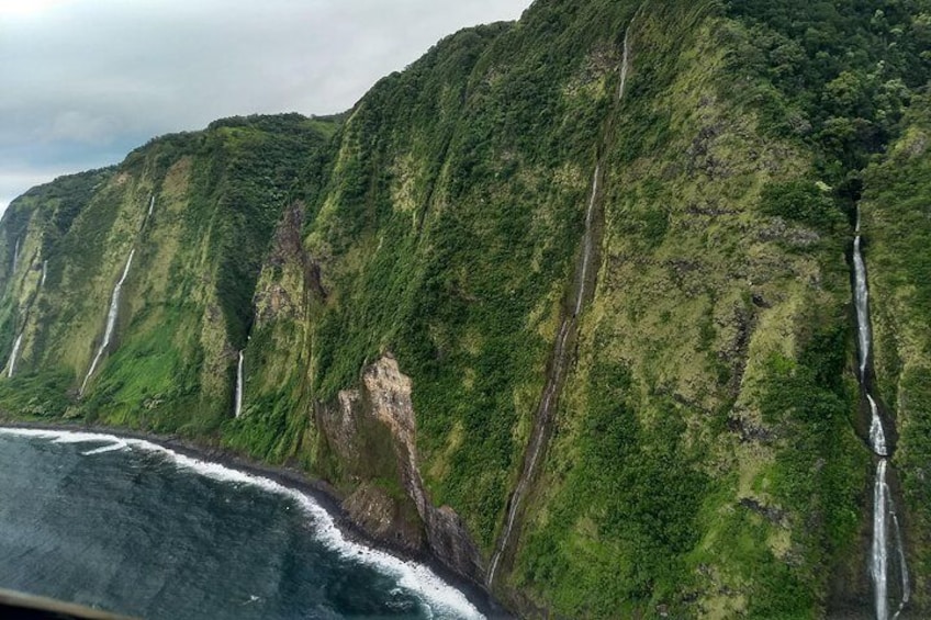 Fly by stunning sea cliff waterfalls as you experience flight by choosing the GREEN Sky-Road to Hana route!