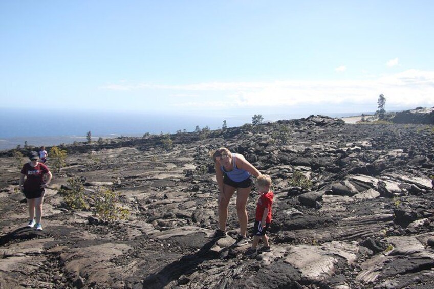 A little person wanted his mom to see the cool rock he found.
