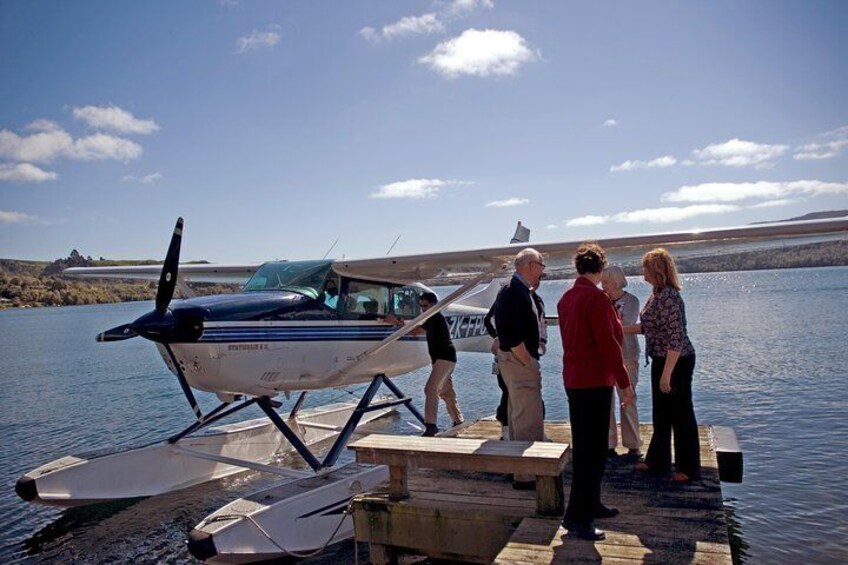 Passengers disembarking float plane