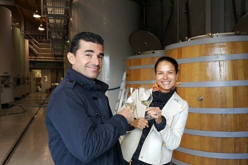 Tasting amongst the barrels