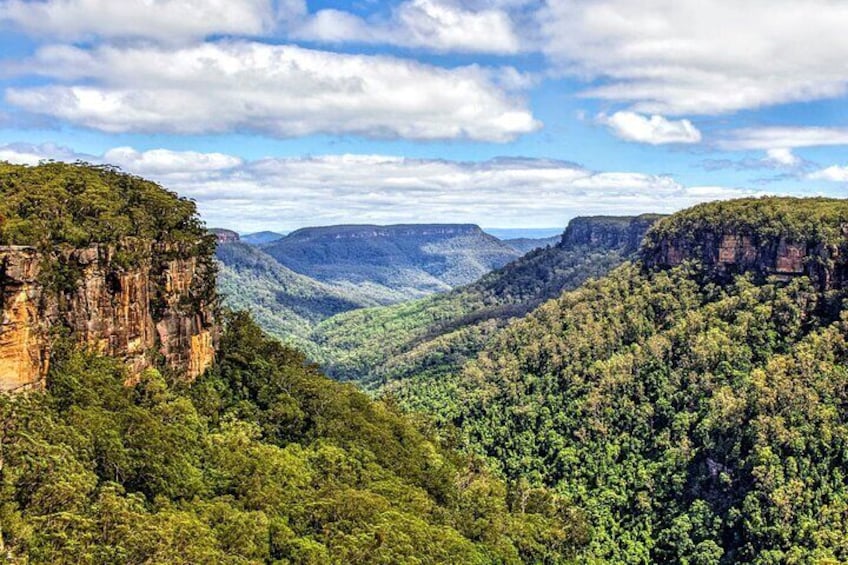 Marvel at sandstone escarpments of the Yarrunga Valley