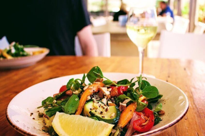 Enjoy lunch at a beachside cafe