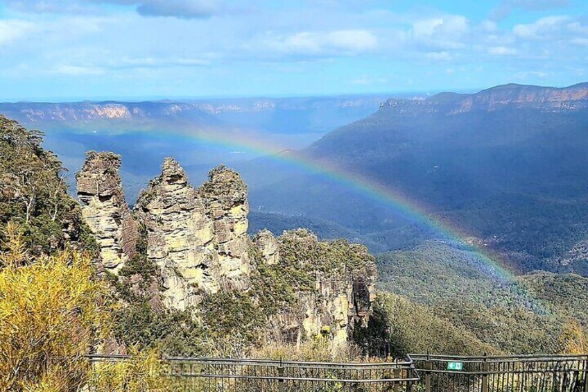 Rainbow over the Three Sisters rock formation