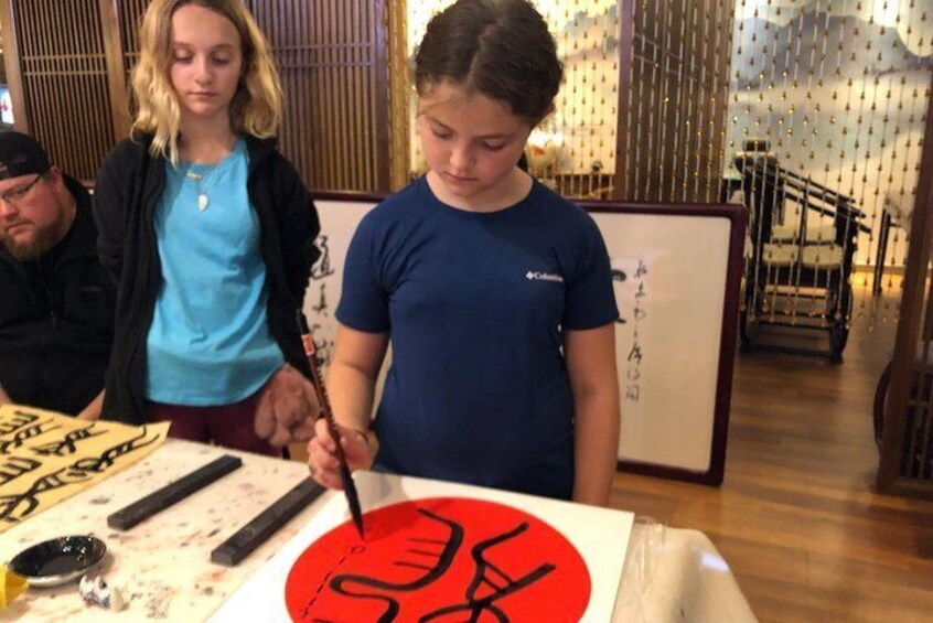 Kids enjoy practice Calligraphy on ricepapers