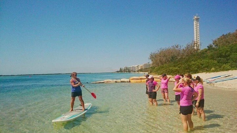 Paddleboard instruction on the crystal clear water