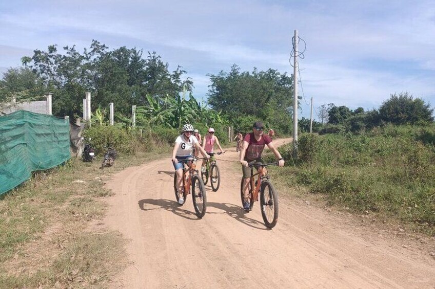 Bike through the dirt road and farmland