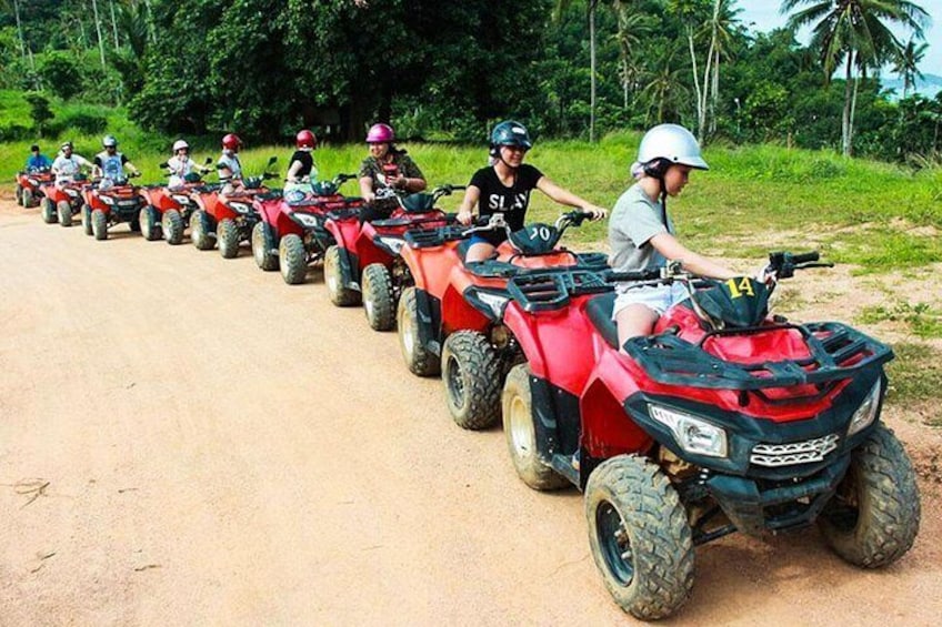 Motor on and off road through jungle trails, over hills and past rubber plantations
