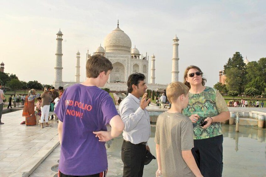 Tour guide explaining the Taj Mahal