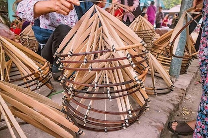 Making traditonal Vietnamese conical hat at the traditonal trade village