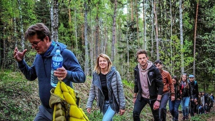 Hiking through the dense pine woods of Aukstaitija National park Park