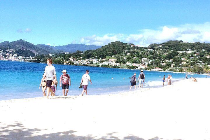 Tourist walking on Grand Anse Beach