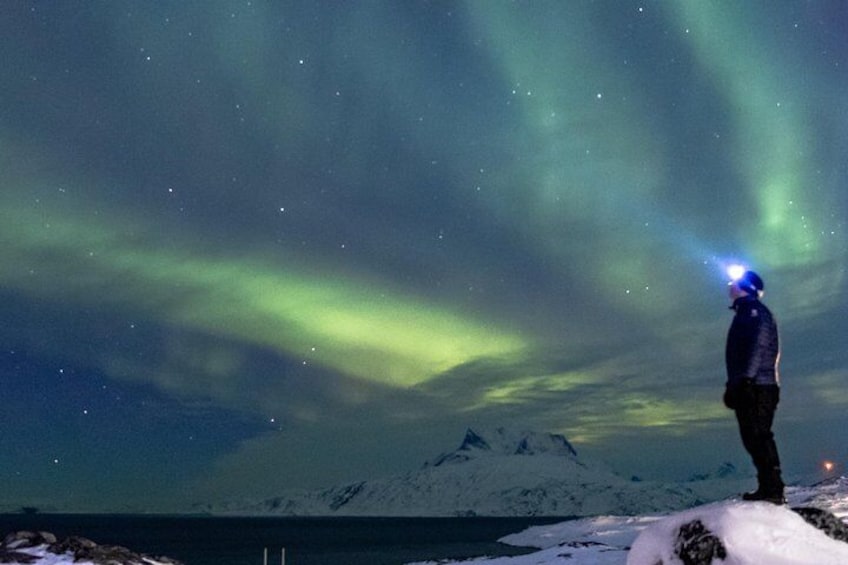 Northern lights and Nuuk icon- Sermitsiaq mountain. Photo By Lasse Kyed