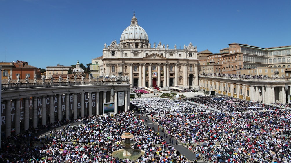 Thousands of people gathered in front of Saint Peter's Basillica in the Vatican.