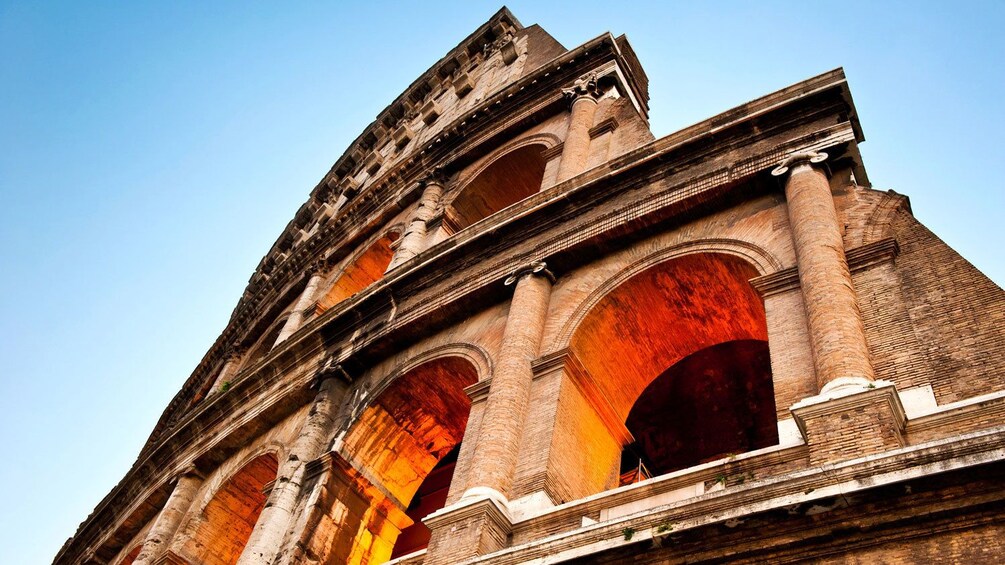Closeup photo of the arches that consist the Colosseum.