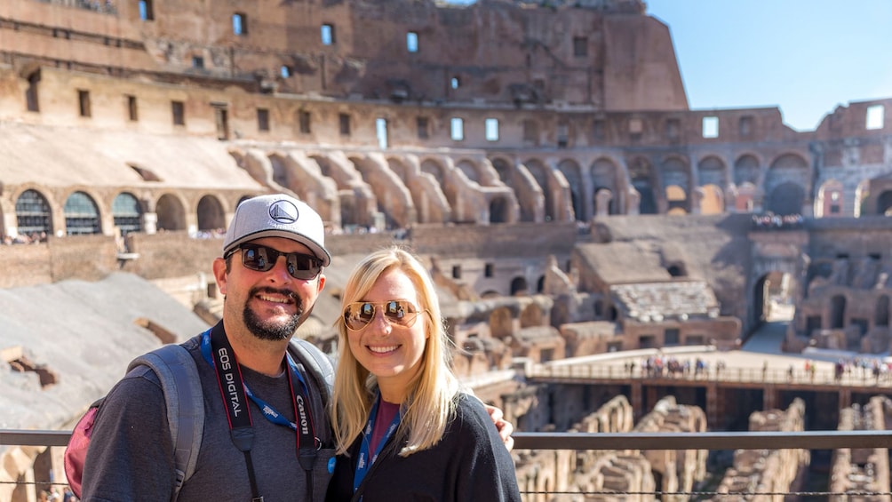 Couple visiting the Colosseum on a sunny day in Rome