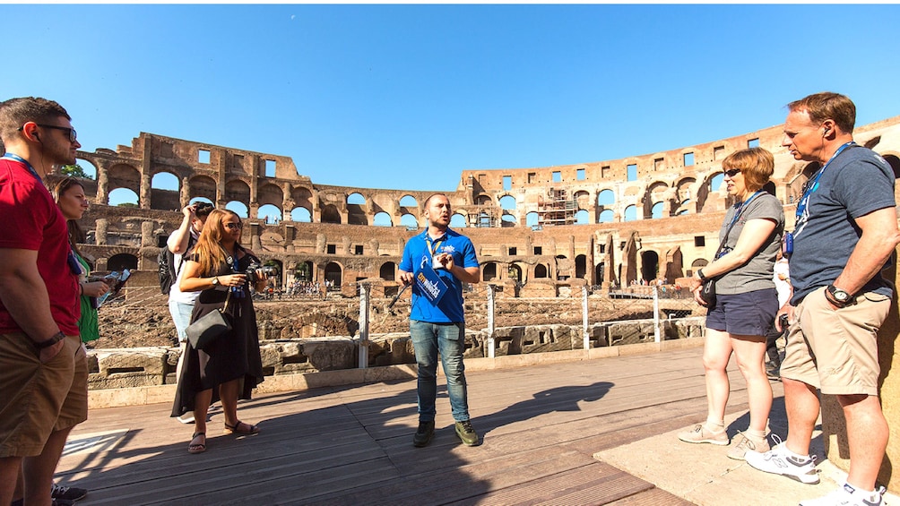 Tour group and guide visiting the Colosseum in Rome