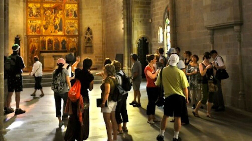 Tourist visiting inside buildings in Gothic Quarter of Barcelona