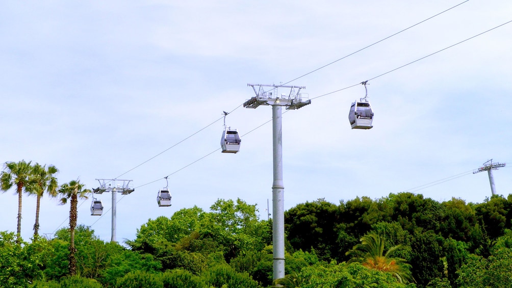 cable cars riding far above ground in Barcelona