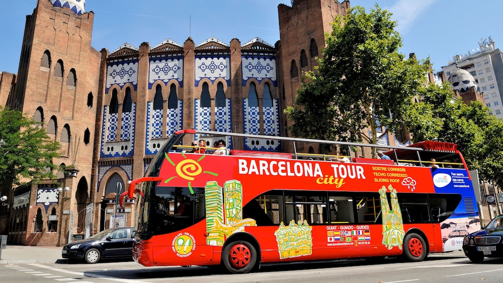 passengers on open air tour bus in Barcelona