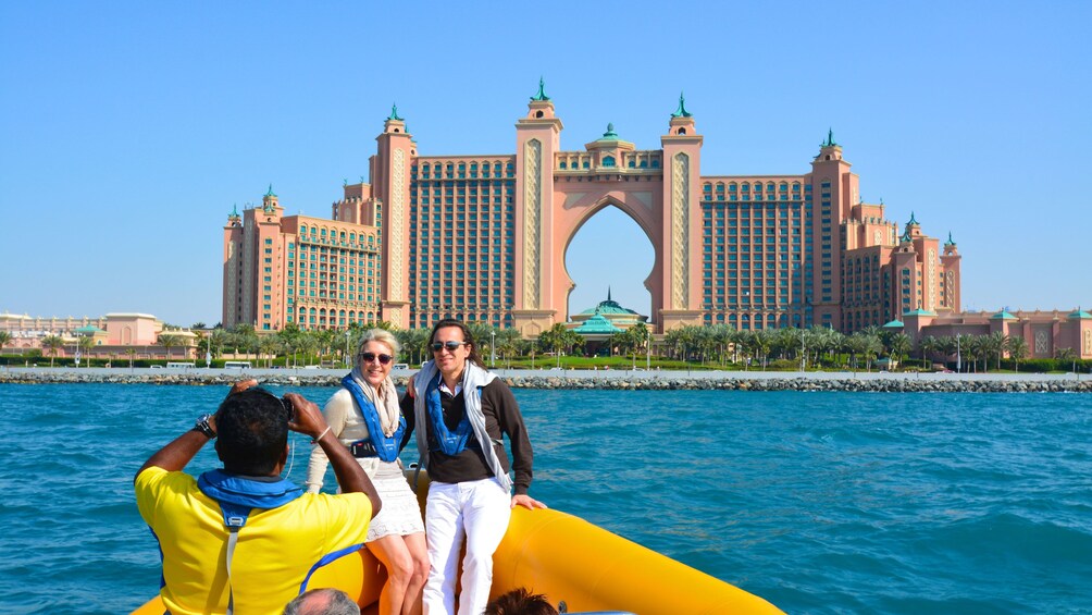 couple gets picture taken by Atlantis hotel in Dubai