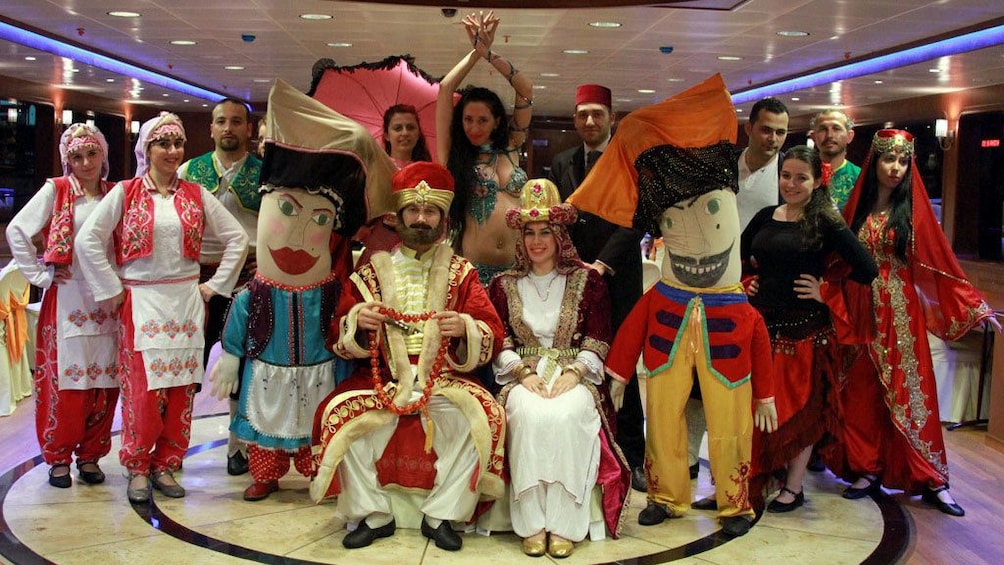 Group of performers take a group picture at the Bosphorus Dinner Cruise 