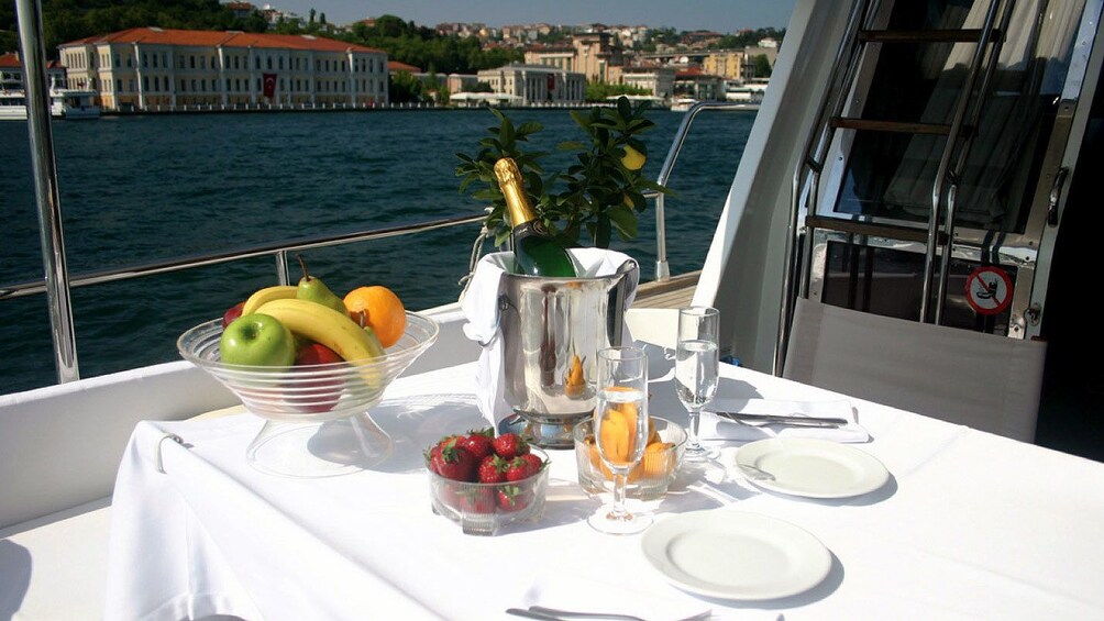 A table with fruit and champagne aboard a sunset cruise on the Bosphorus in Istanbul 
