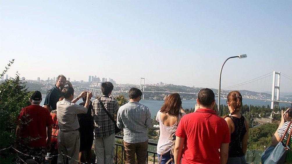 Tour group taking a picture of the cityscape of Istanbul 