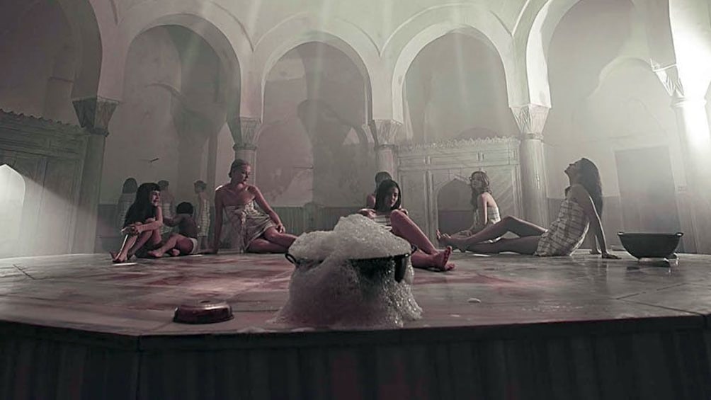Group of guests relax inside the Cemberlitas Hamam in Istanbul  