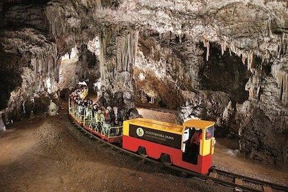 Postojna Cave and Predjama Castle from Sistiana