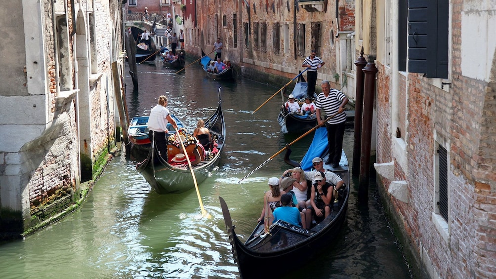 Gondolas in a narrow canal in Venice Italy