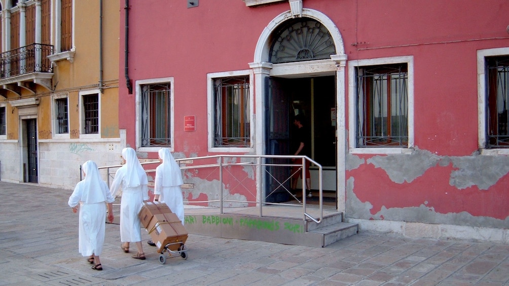 Nuns walking on the street in Venice Italy