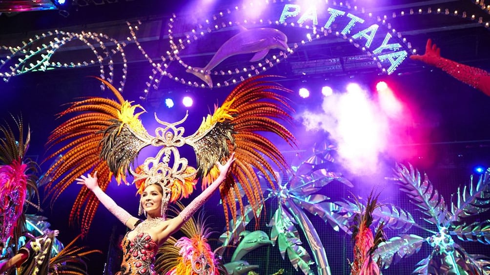 Performers in elaborate feathered head dresses performing at Tiffany's Cabaret Show in Pattaya